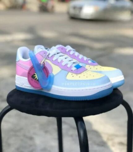 SA DB TF0001 Nike Air Force 1 '07 LX "UV Reactive". They feature a special sun-activated technology where the leather upper, which typically appears white or in pastel shades indoors, changes into a multi-colored palette (including shades of pink, yellow, and blue) when exposed to UV light. PAXi Free courier nation wide